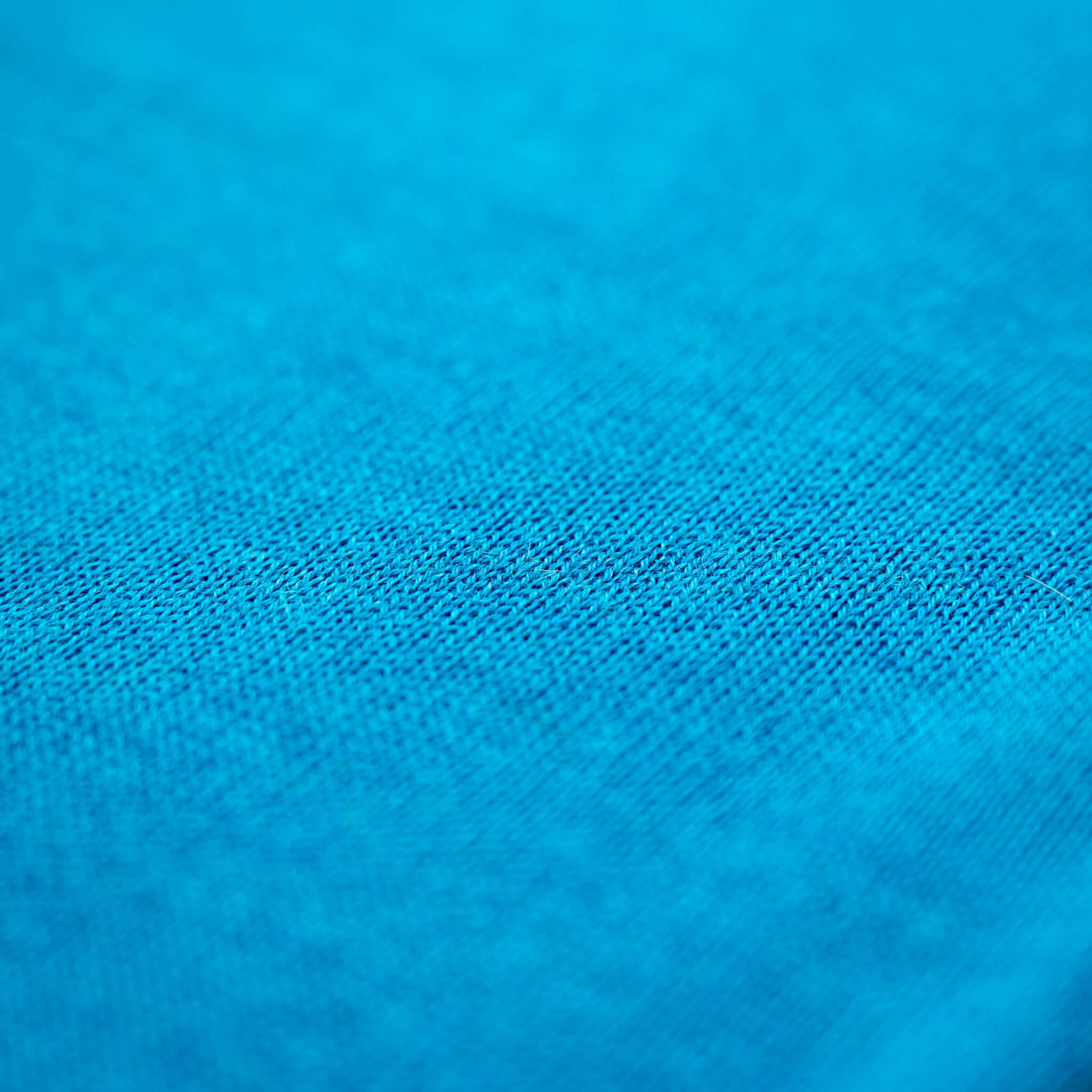 Nahaufnahme Textil des türkisfarbigen Alpaka Schals für Damen